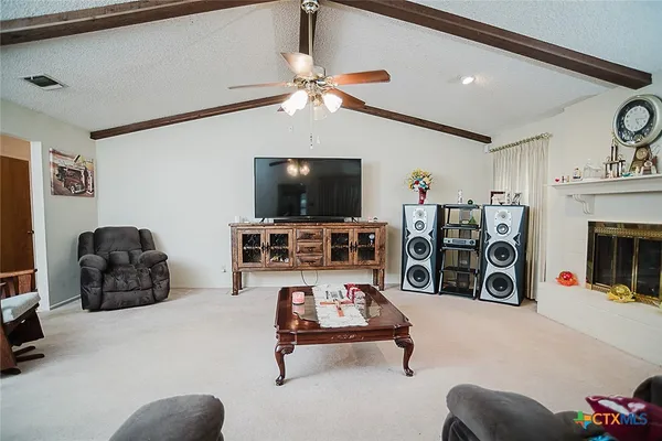 a kitchen with cabinets a sink and a refrigerator