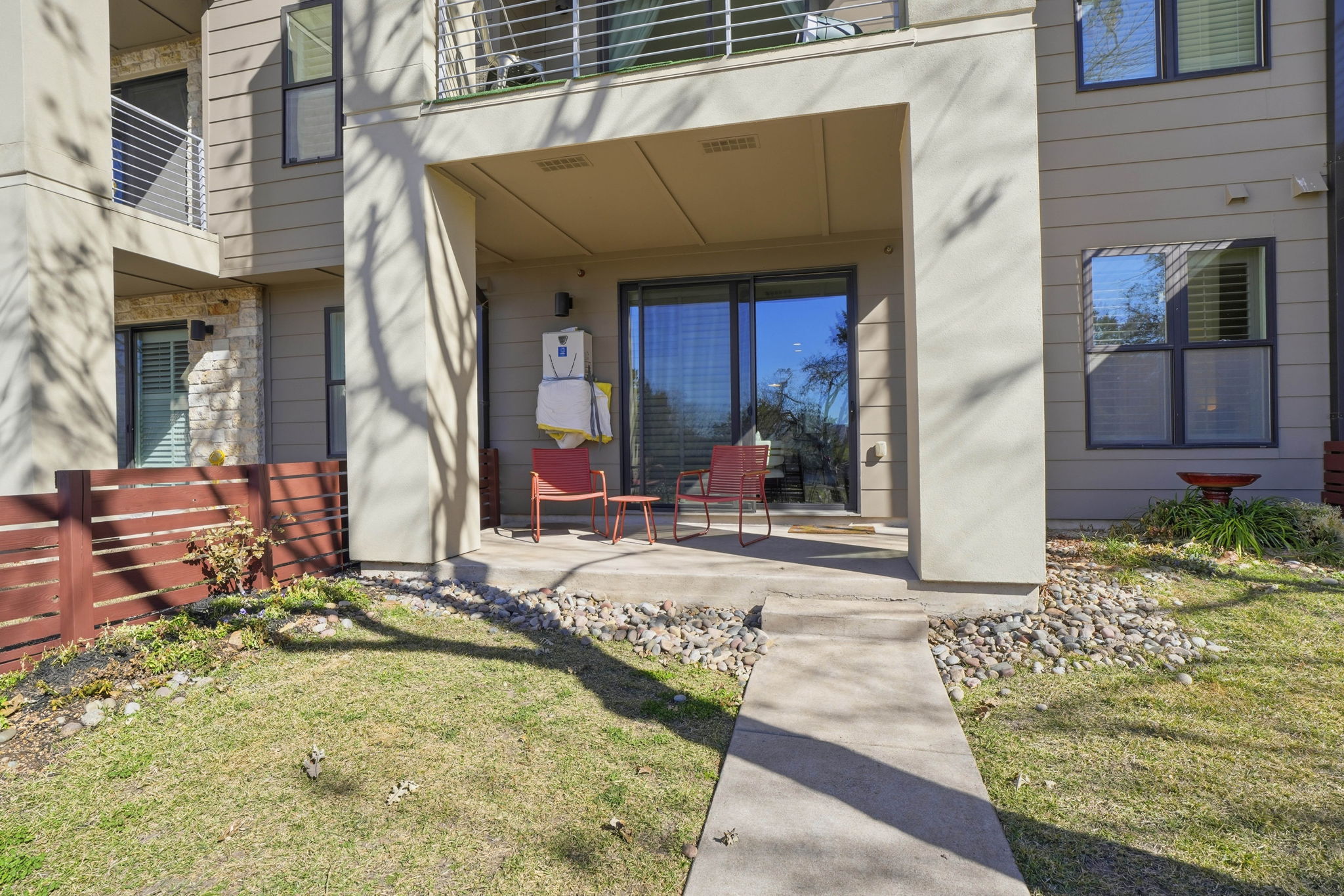 2805 Dulce Lane, Unit 1002 Austin, TX 78704 - Photo 12 of 24 Doorway to property featuring a lawn