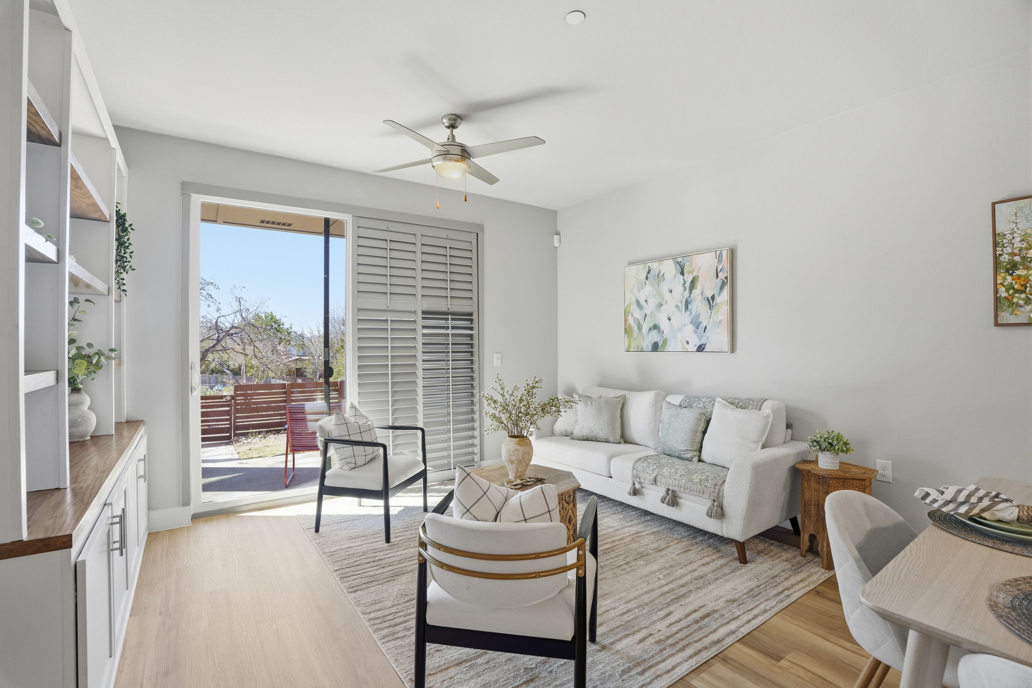 2805 Dulce Lane, Unit 1002 Austin, TX 78704 - Photo 4 of 23 Living room featuring light wood finished floors and a ceiling fan