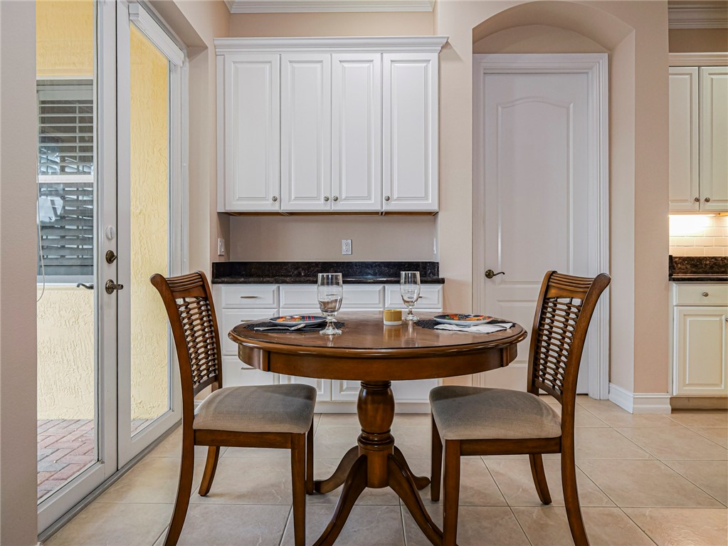 4570 Bridgepointe Way, Unit 148 Vero Beach, FL 32967 - Photo 11 of 32 a view of a dining room with furniture