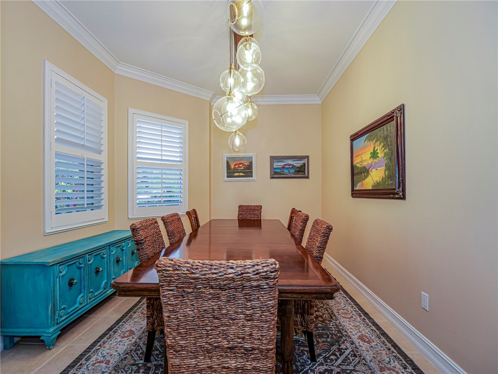 4570 Bridgepointe Way, Unit 148 Vero Beach, FL 32967 - Photo 12 of 32 a dining room with furniture and window