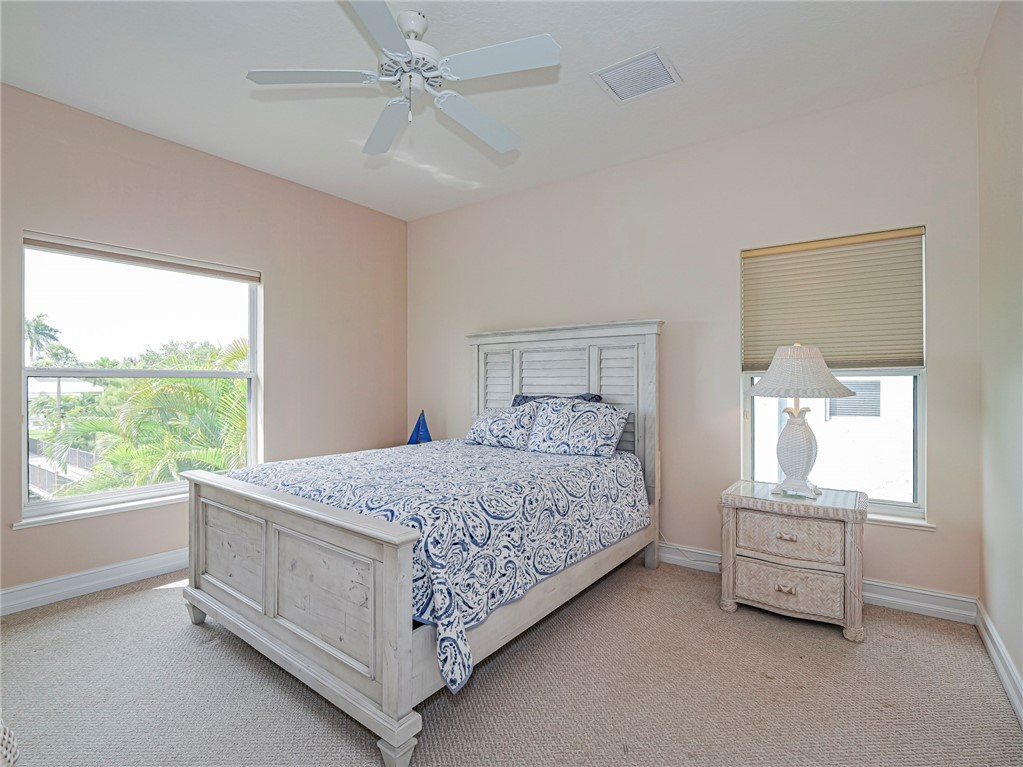 4570 Bridgepointe Way, Unit 148 Vero Beach, FL 32967 - Photo 19 of 32 a bedroom with a bed and a window