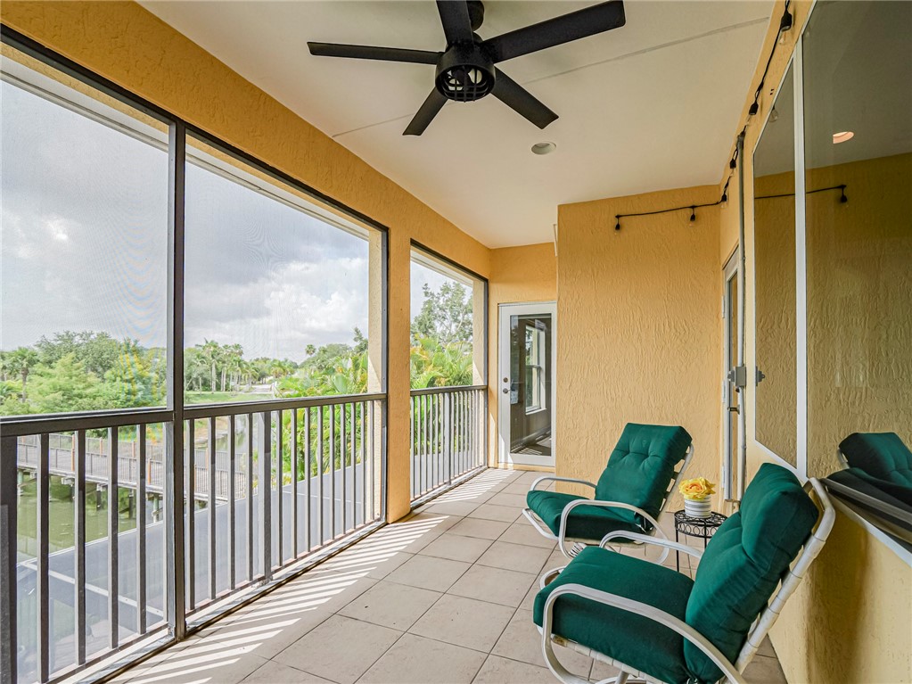 4570 Bridgepointe Way, Unit 148 Vero Beach, FL 32967 - Photo 23 of 32 a living room with furniture and a large window