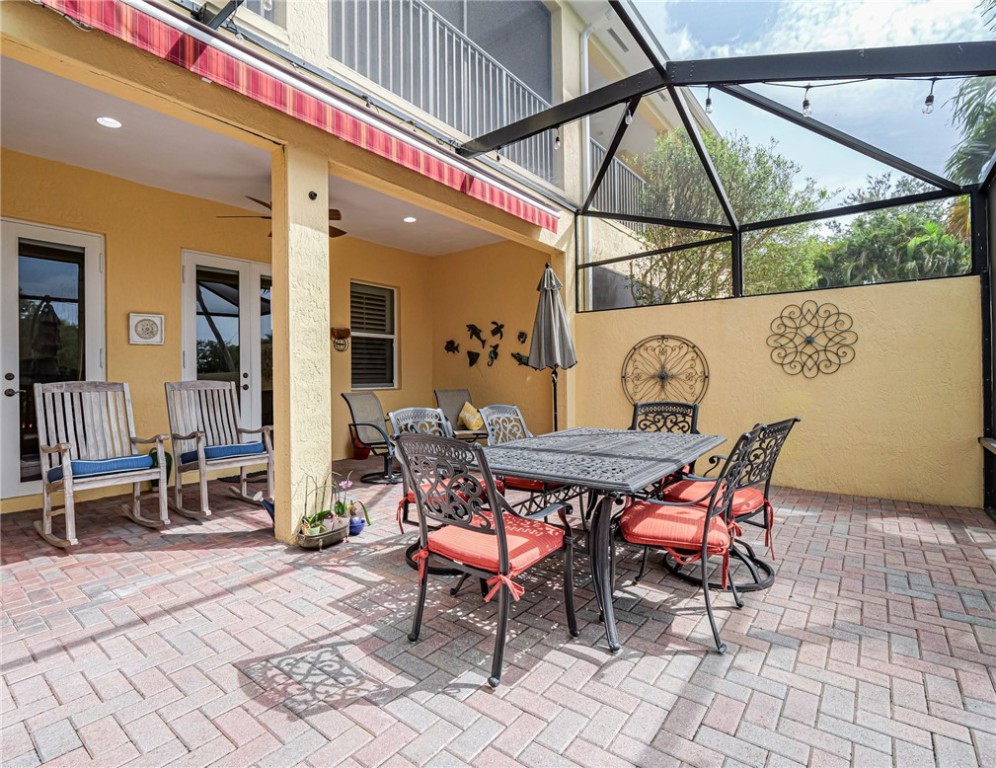 4570 Bridgepointe Way, Unit 148 Vero Beach, FL 32967 - Photo 26 of 32 a dining area with a table and chairs