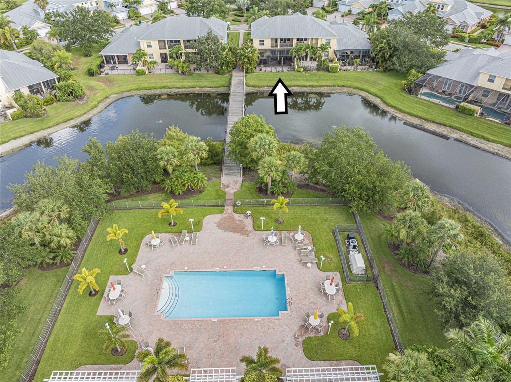 4570 Bridgepointe Way, Unit 148 Vero Beach, FL 32967 - Photo 31 of 32 an aerial view of a house with swimming pool and outdoor seating