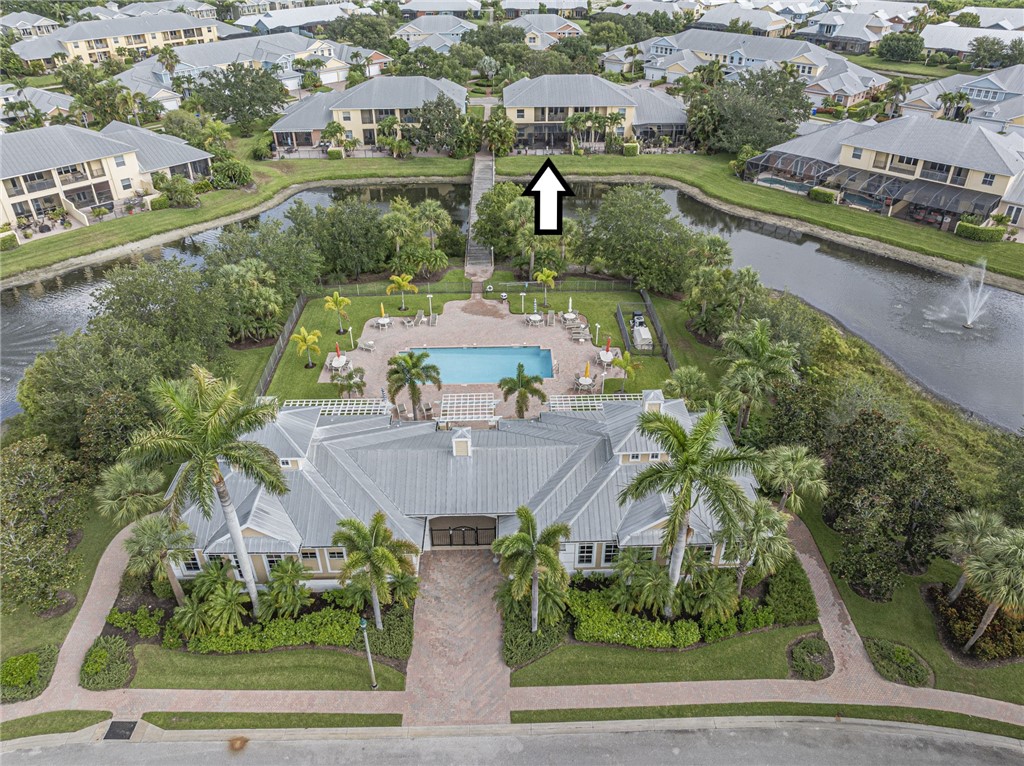 4570 Bridgepointe Way, Unit 148 Vero Beach, FL 32967 - Photo 32 of 32 an aerial view of residential houses with outdoor space and swimming pool