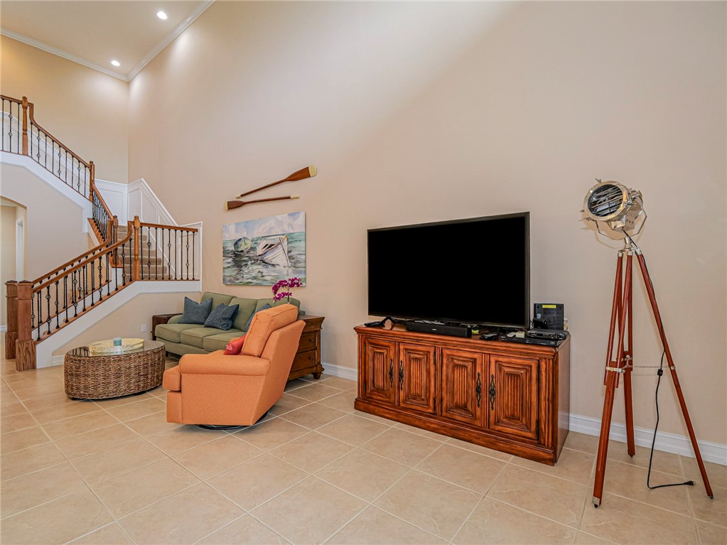 4570 Bridgepointe Way, Unit 148 Vero Beach, FL 32967 - Photo 5 of 32 a living room with furniture and a flat screen tv