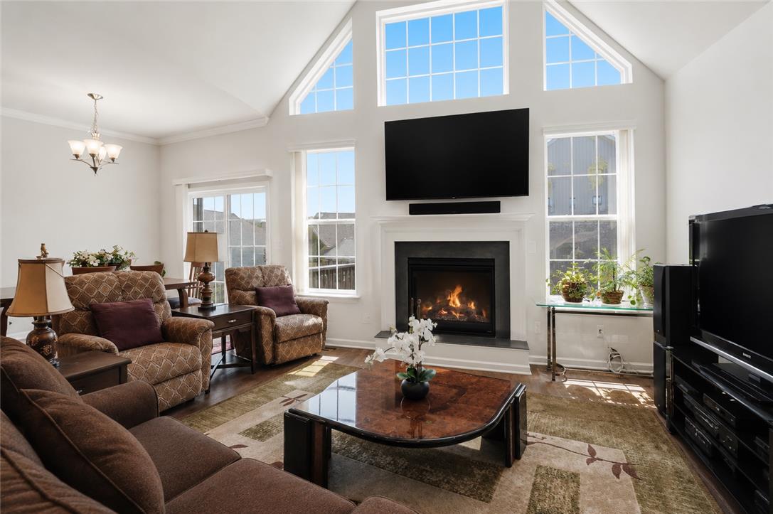 4120 Eveningstar Road Emmaus, PA 18049 - Photo 24 of 62 A striking fireplace forms the focal point of this sun-filled living area with vaulted ceilings.