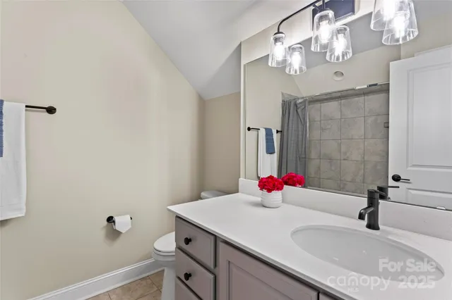 a bathroom with a sink vanity and a mirror