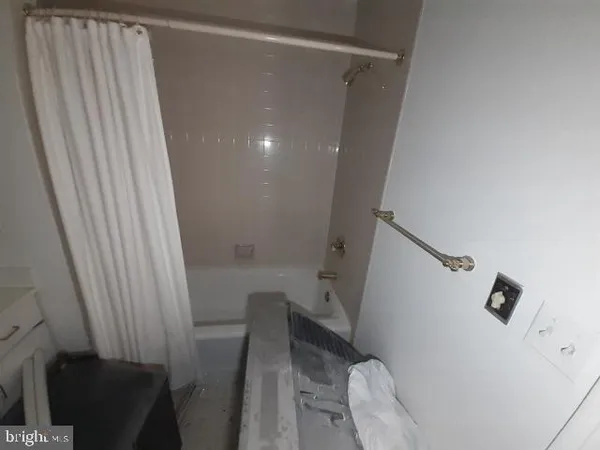 a bathroom with a shower and toilet