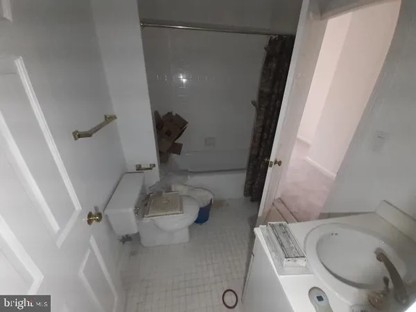 a bathroom with a sink and toilet