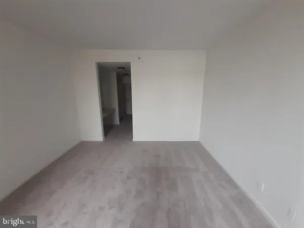 a view of a livingroom and a livingroom with furniture