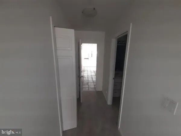 a living room with furniture and a piano