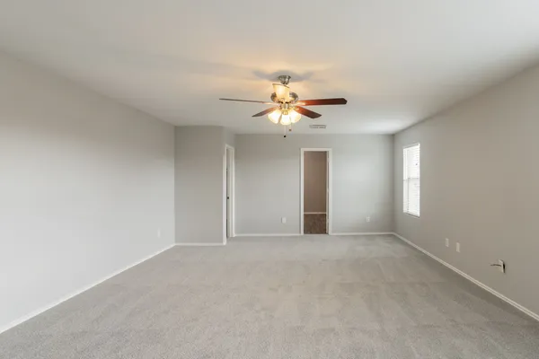 a view of an empty room with a window