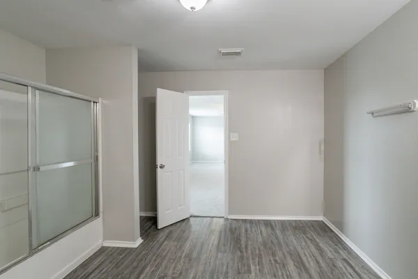 a view of a bathroom with sink and mirror