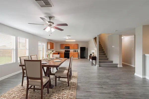 a view of a dining room with furniture and window