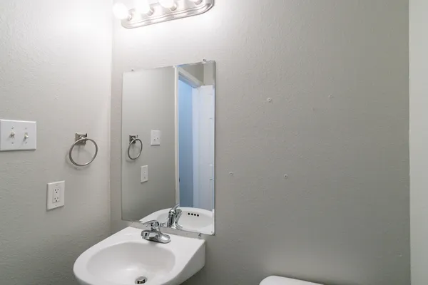 a bathroom with a shower and toilet