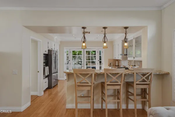 a view of a dining room with furniture and wooden floor