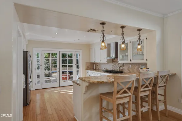 a view of a kitchen from a dining room