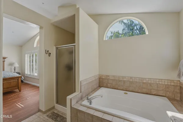 a bathroom with a tub and sink