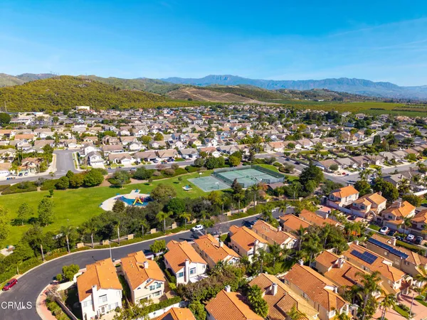 an aerial view of residential houses with outdoor space