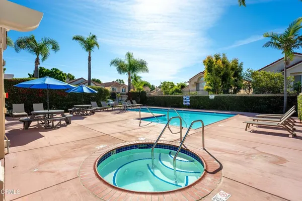 a view of a swimming pool with a patio