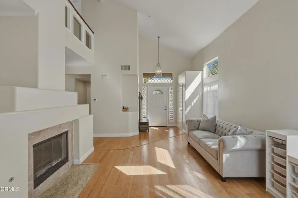 a living room with furniture and a fireplace