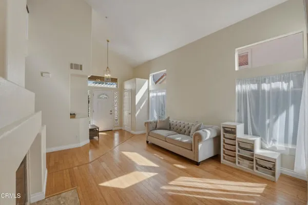 a living room with furniture and a rug