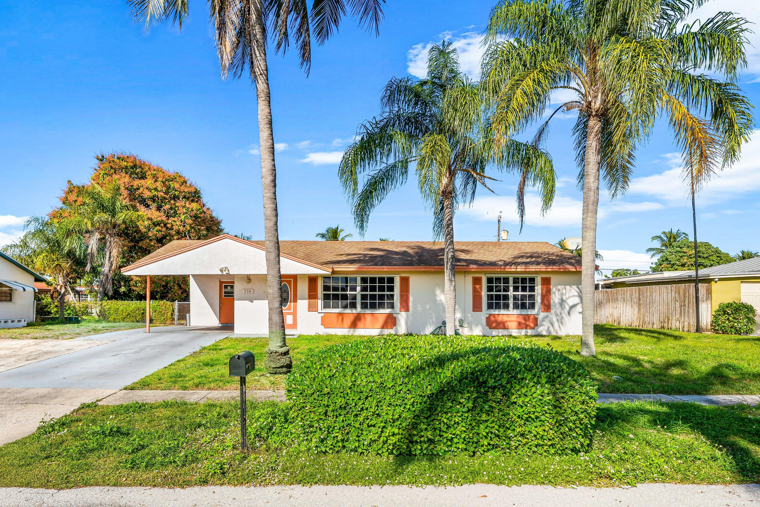 330 West 22nd Court Riviera Beach, FL 33404 - Photo 2 of 34 Front of the home
