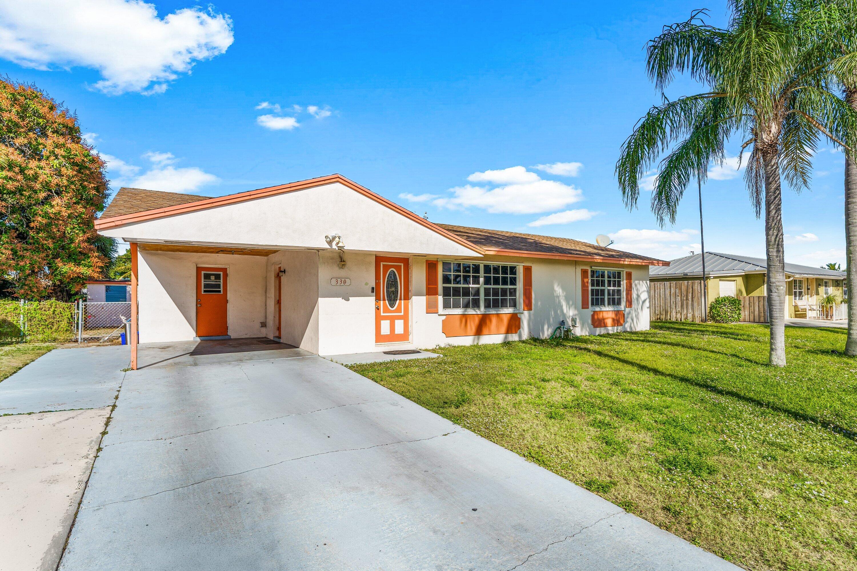 330 West 22nd Court Riviera Beach, FL 33404 - Photo 3 of 34 Front of the home
