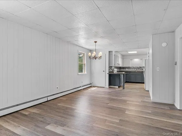 a view of a kitchen with a sink and a stove top oven