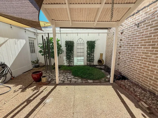 a view of a back yard of the house