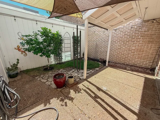 a backyard of a house with seating space