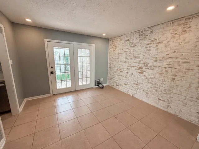a view of an empty room and a window