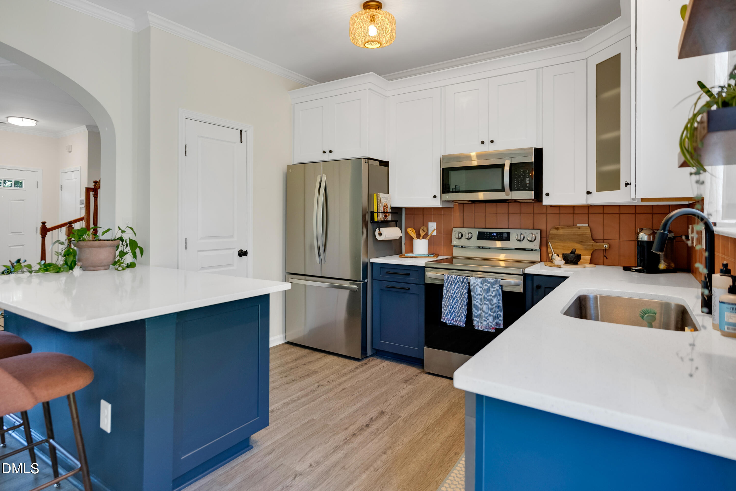 3617 Sugar Tree Place Durham, NC 27713 - Photo 13 of 38 a kitchen with stainless steel appliances a sink a refrigerator a microwave a stove and a refrigerator