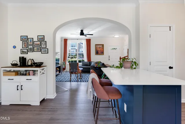 a kitchen with stainless steel appliances a sink a refrigerator a microwave a stove and a refrigerator