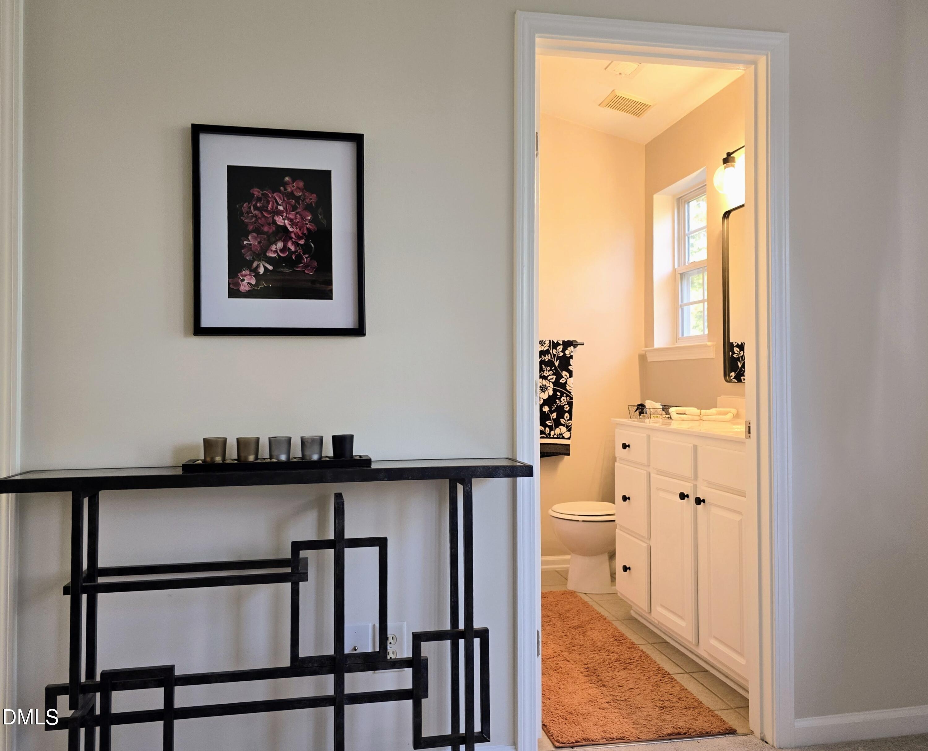 3617 Sugar Tree Place Durham, NC 27713 - Photo 26 of 38 a view of a hallway with wooden floor and a dining room
