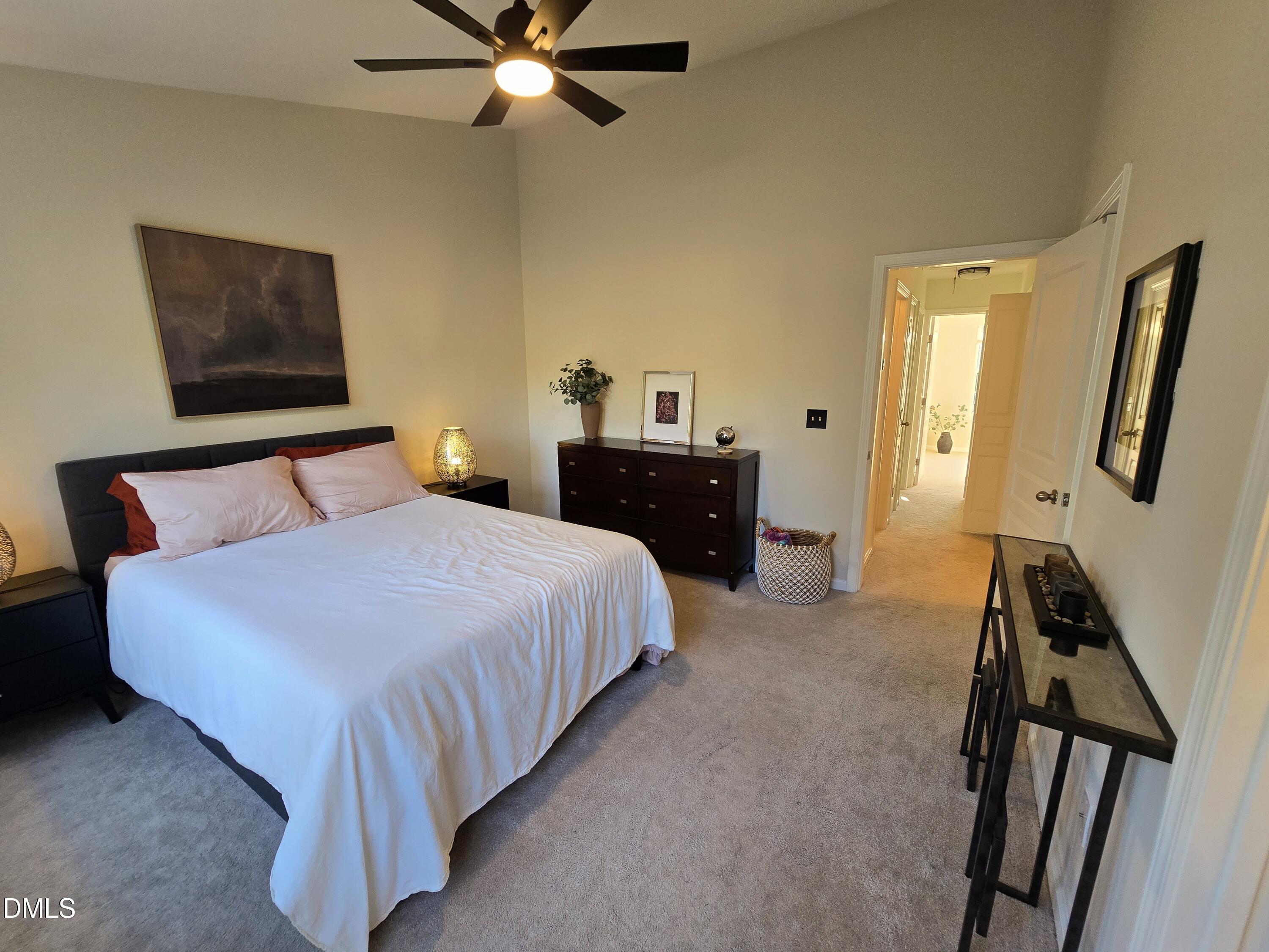 3617 Sugar Tree Place Durham, NC 27713 - Photo 29 of 38 a bedroom with a bed and a chandelier