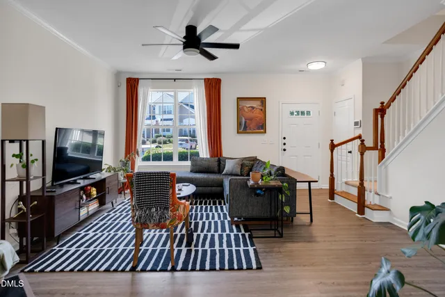 a view of a patio with table and chairs with wooden floor and fence