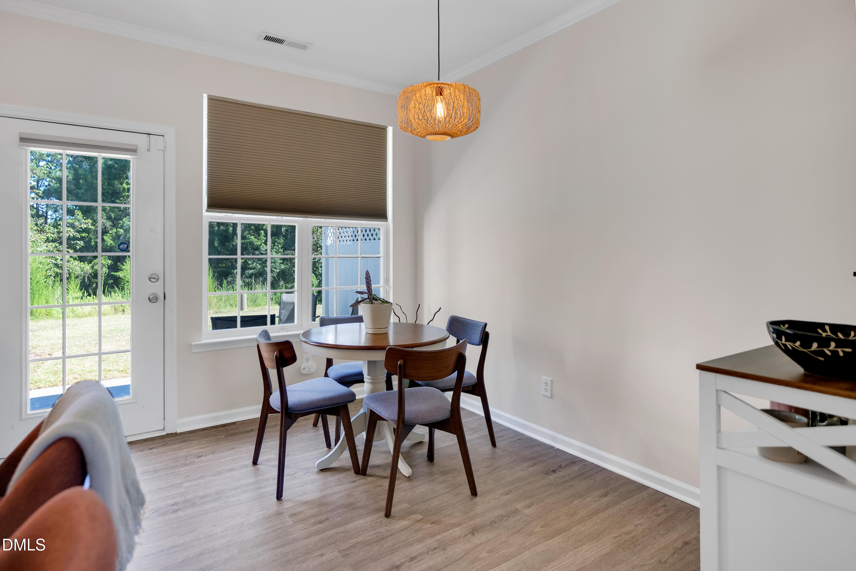 3617 Sugar Tree Place Durham, NC 27713 - Photo 9 of 38 a dining room with furniture and wooden floor