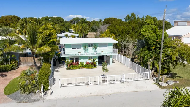a view of a house with outdoor space and street view