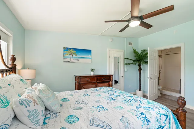 a bathroom with a sink a toilet and a shower curtain