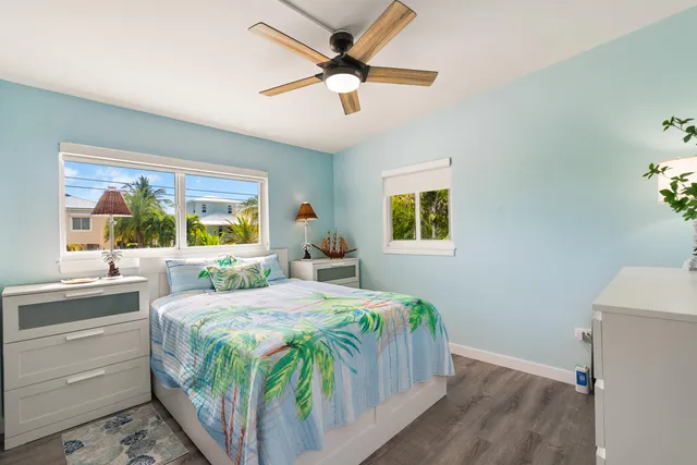 a bathroom with a shower curtain and a sink