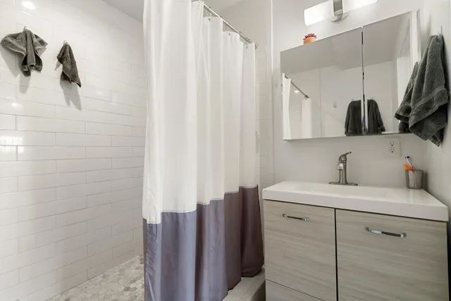 a utility room with sink dryer and washer