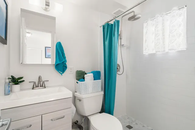 a bedroom with a bed and a desk