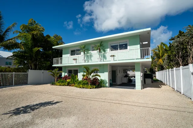a view of a swimming pool with a yard