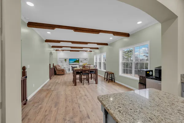 a view of a livingroom with furniture and window