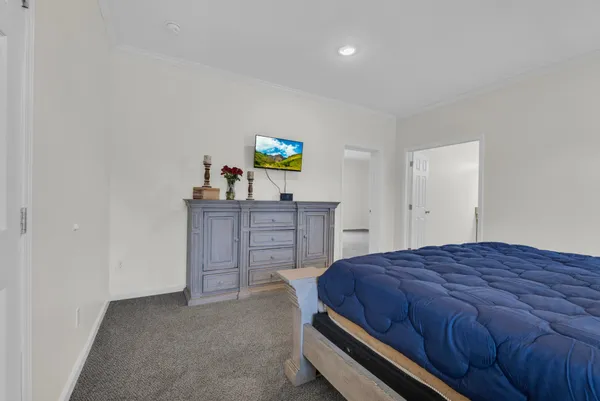 a bedroom with a bed and a desk