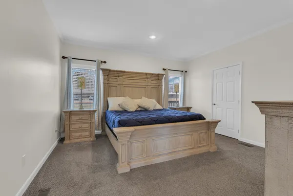 a bedroom with a bed and cabinets