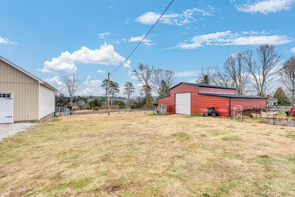 a swimming pool with yard and outdoor seating